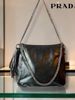 AUTHENTIC PRADA BUTTER SOFT BLACK LEATHER removable chain and tassel.
